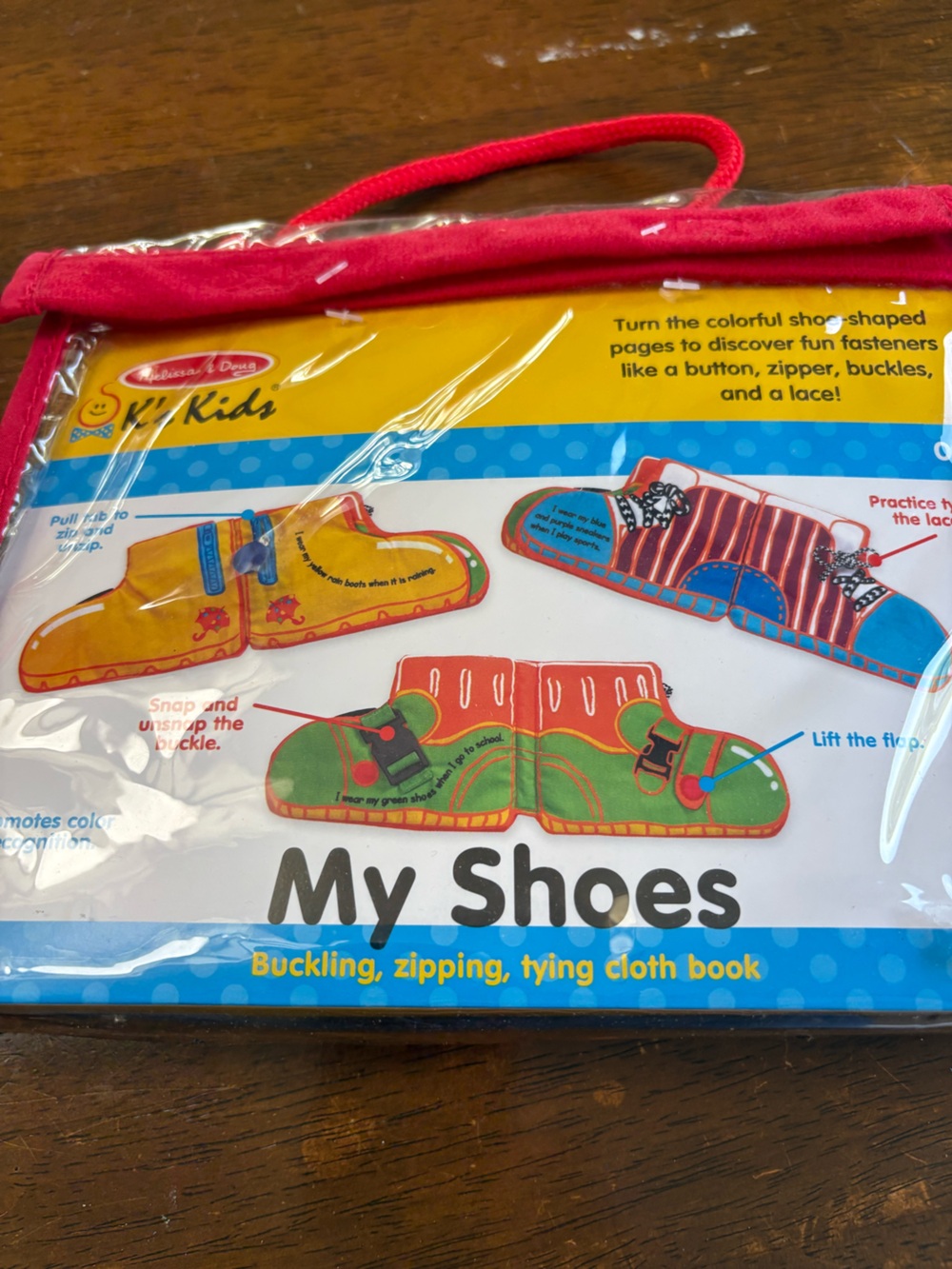 Melissa & Doug My Shoes Cloth Book - Red, Yellow, Green, Blue
